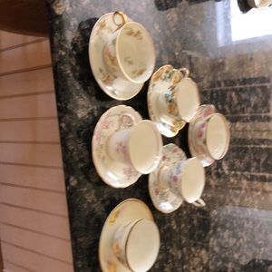 6 assorted china teacups and matching saucers.
